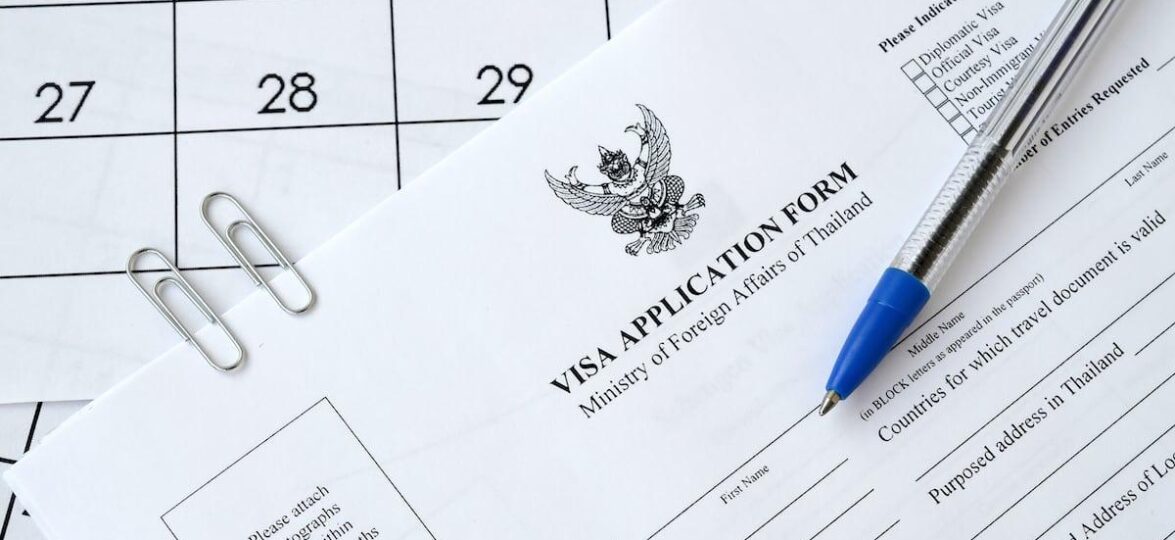 tailand viza thailand visa application form blue pen paper calendar page