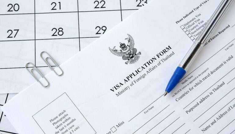 tailand viza thailand visa application form blue pen paper calendar page