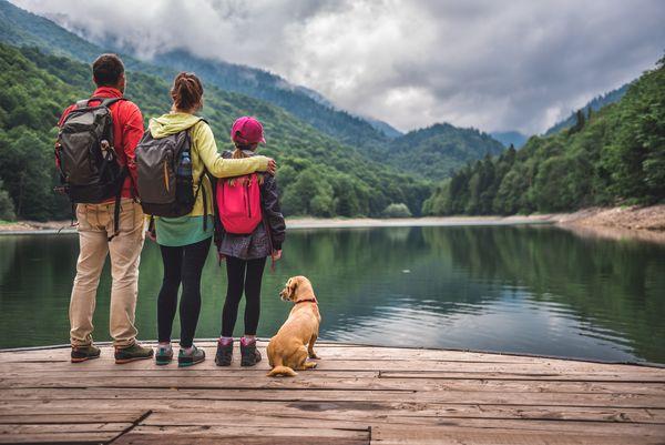 Черногория_family with dog standing pier montenegro